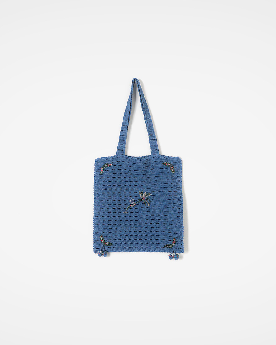 In a crochet pattern woven one stitch at a time<br> Handmade Tote with Beads