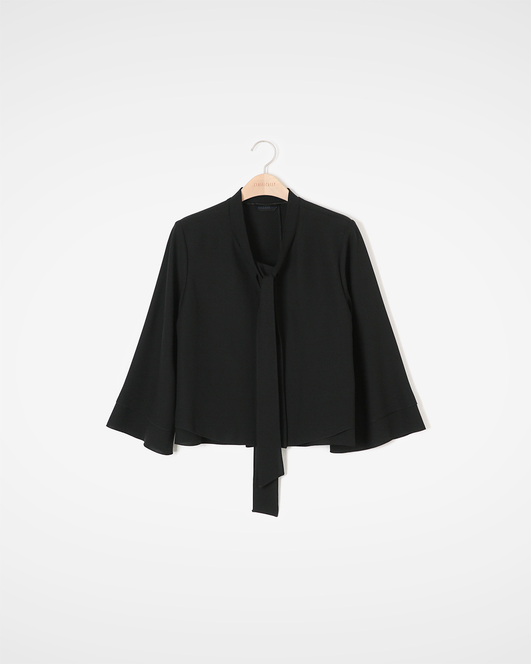 Delicate sophistication, softly flowing silhouette<br> graceful tie flare blouse