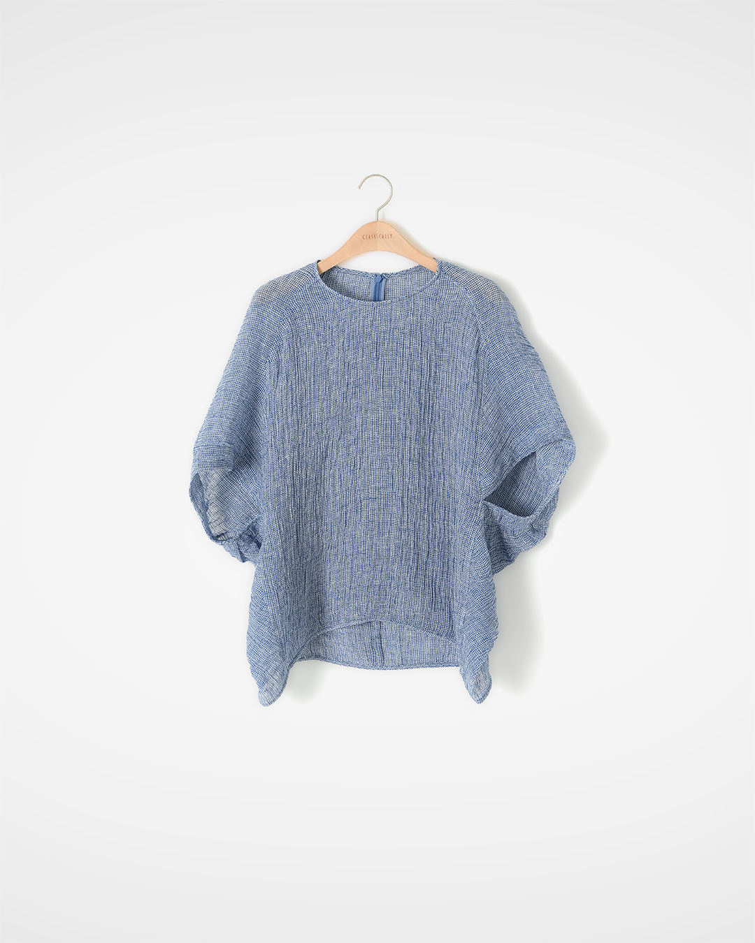 flowing elegantly along the body<br> Textured Linen Draped Blouse