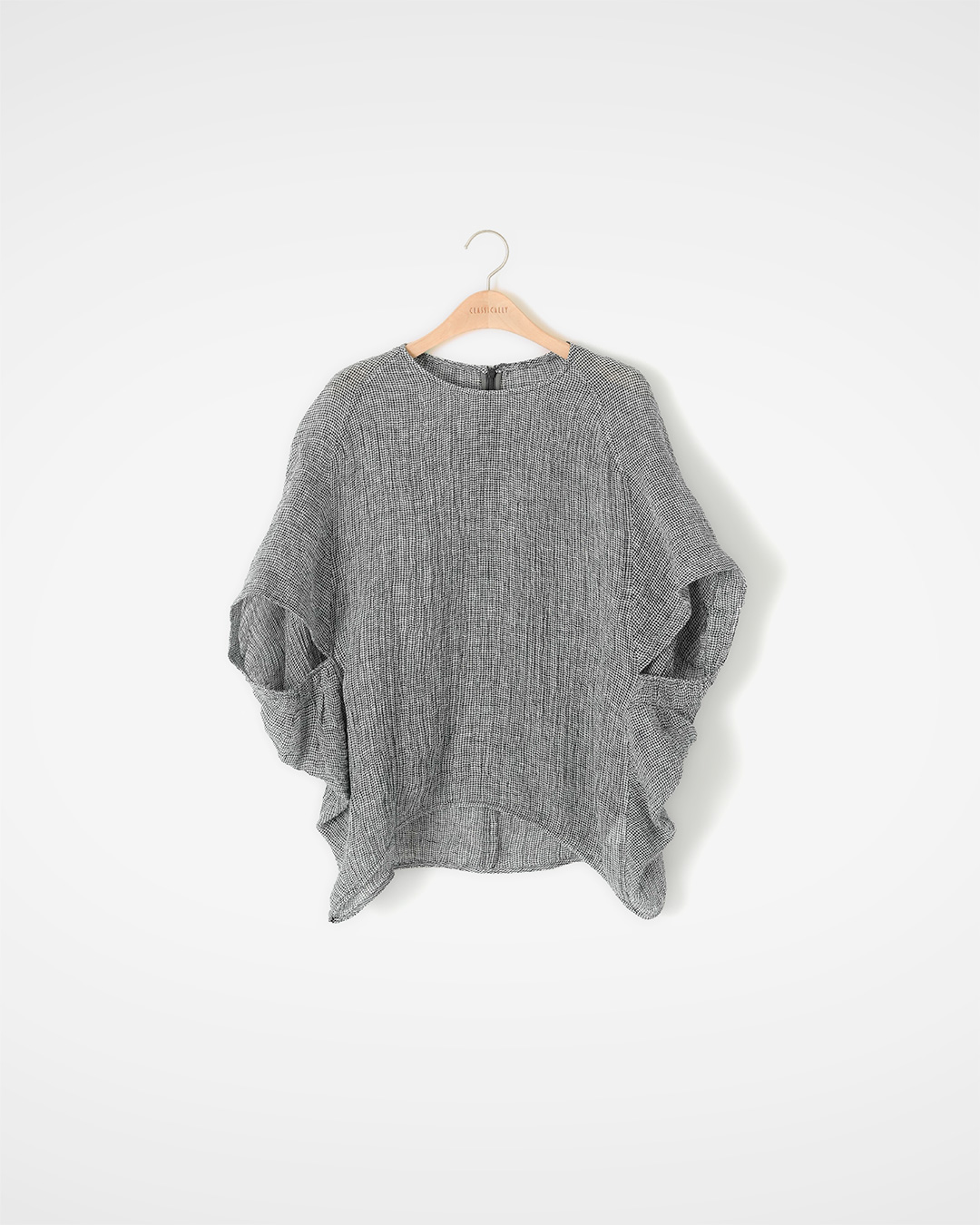 Flowing elegantly along the body<br> Textured Linen Draped Blouse