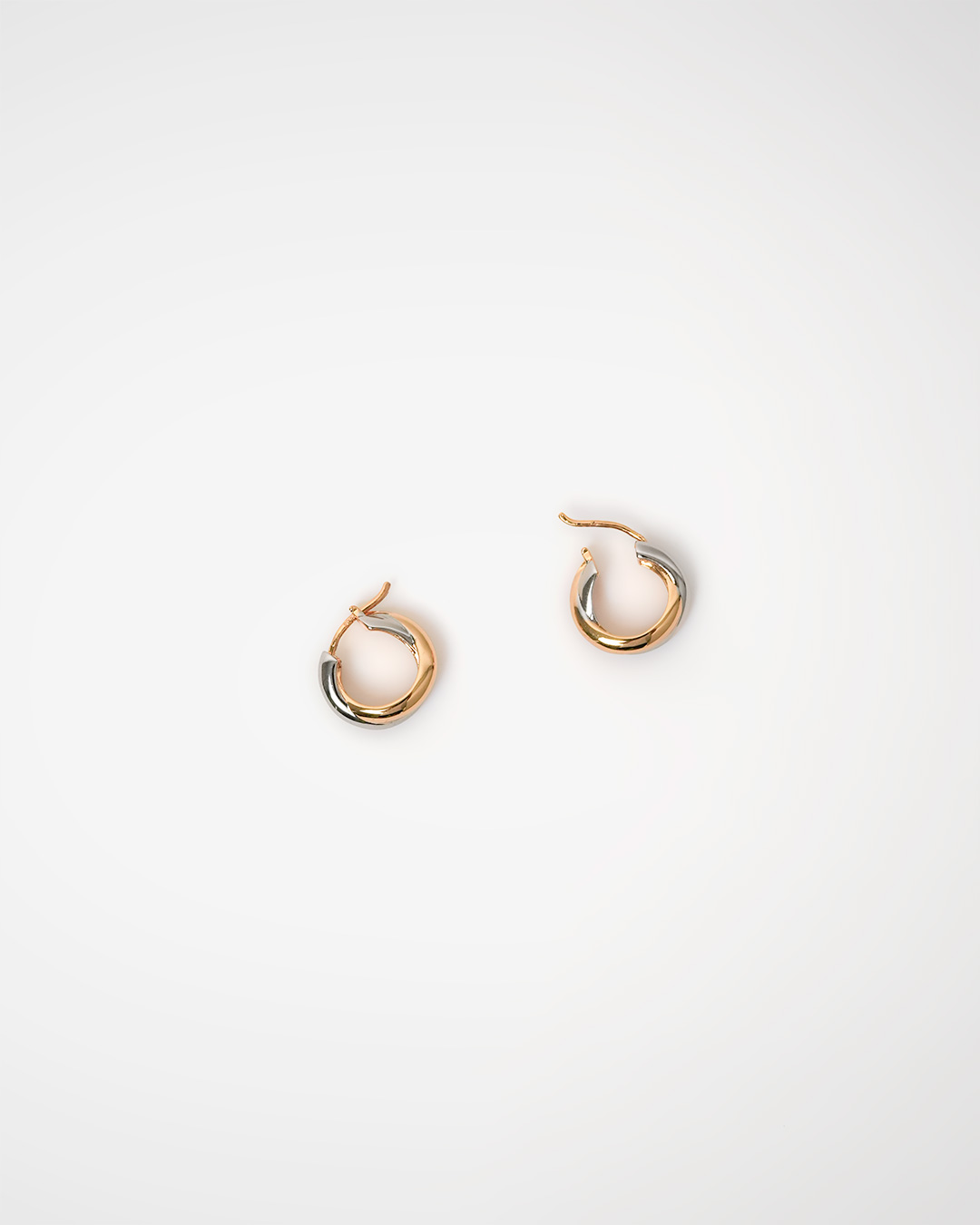 A day that needs a subtle sparkle<br> Two Tone Twist Hoop Earrings