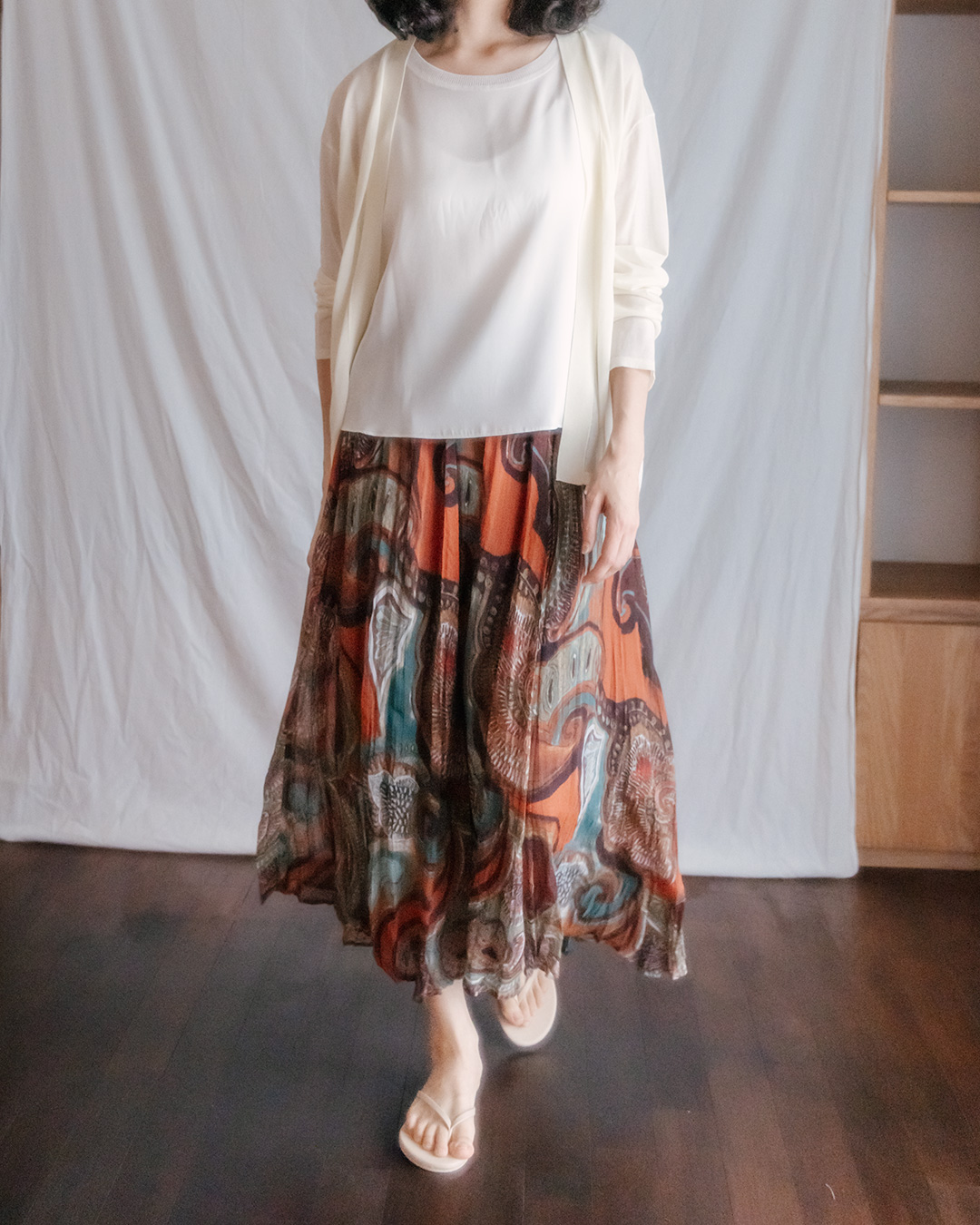 It becomes the centerpiece of the look even when paired with a simple top.<br> painterly sheer pattern skirt